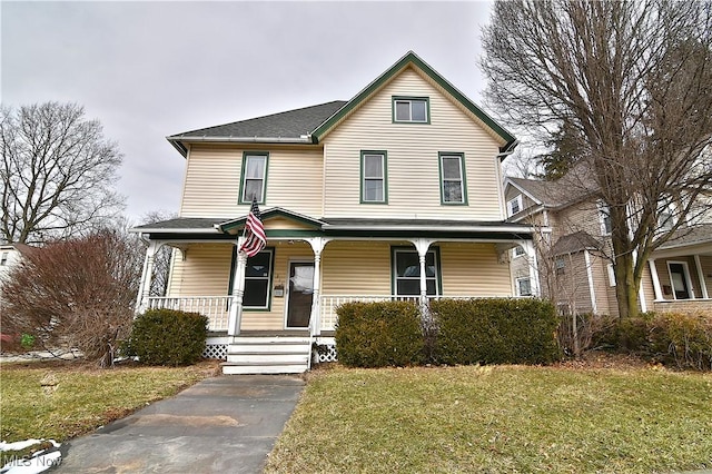 view of front facade featuring a porch and a front yard