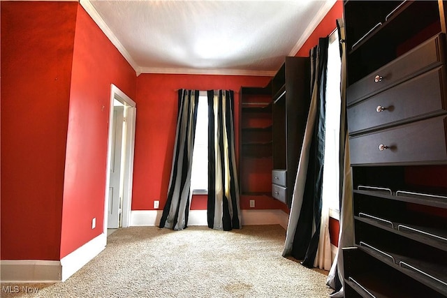 bedroom with ornamental molding, light carpet, and baseboards