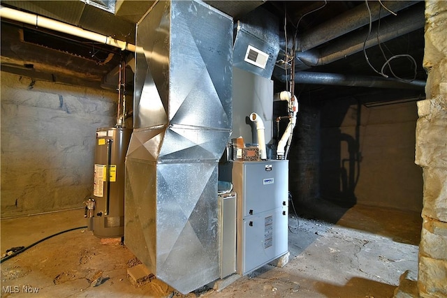 utility room with water heater and visible vents