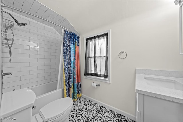 full bath with toilet, shower / bath combo with shower curtain, vanity, tile patterned flooring, and baseboards