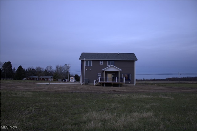 back of house featuring a yard