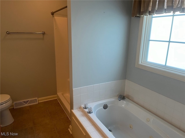 bathroom featuring visible vents, a whirlpool tub, a shower stall, and toilet