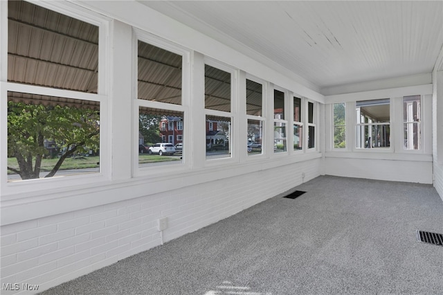 unfurnished sunroom featuring visible vents