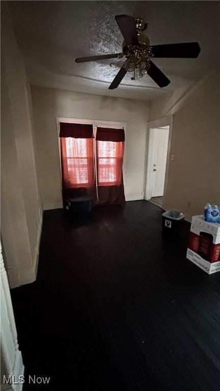 spare room featuring dark wood finished floors