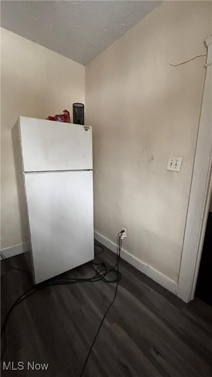 1227 E 113th St, Cleveland, OH 44108 - interior space with baseboards, wood finished floors, and freestanding refrigerator