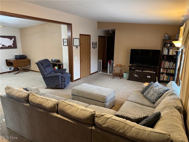 living room featuring light carpet and baseboards