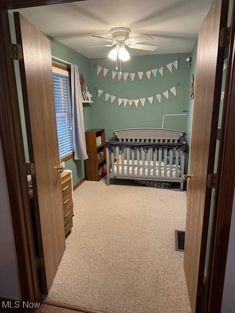 bedroom featuring a ceiling fan and carpet flooring