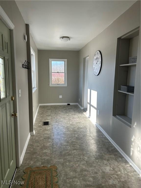 interior space with visible vents and baseboards