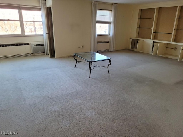 interior space featuring light carpet and radiator