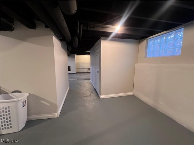 unfinished basement featuring baseboards