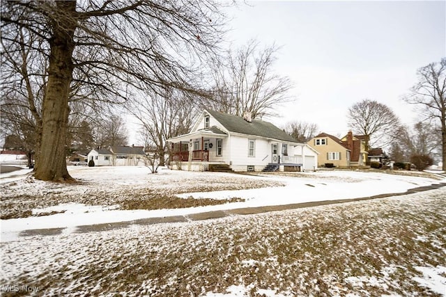 view of snowy exterior featuring a residential view