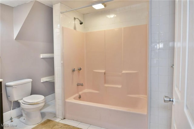 full bath featuring bathing tub / shower combination, toilet, and tile patterned floors