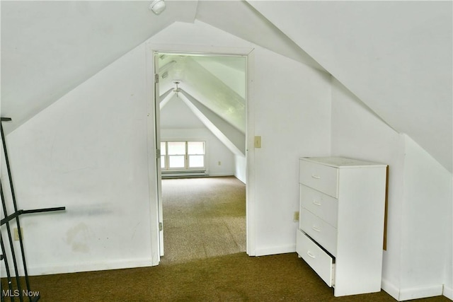 bonus room with a baseboard heating unit, dark carpet, and vaulted ceiling