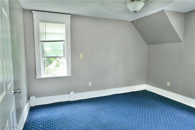 bonus room with carpet, lofted ceiling, and baseboards