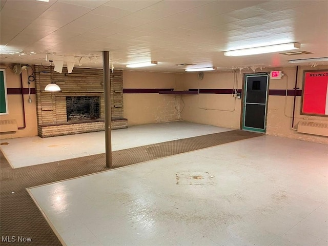 finished basement featuring a fireplace