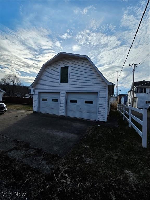 detached garage with fence