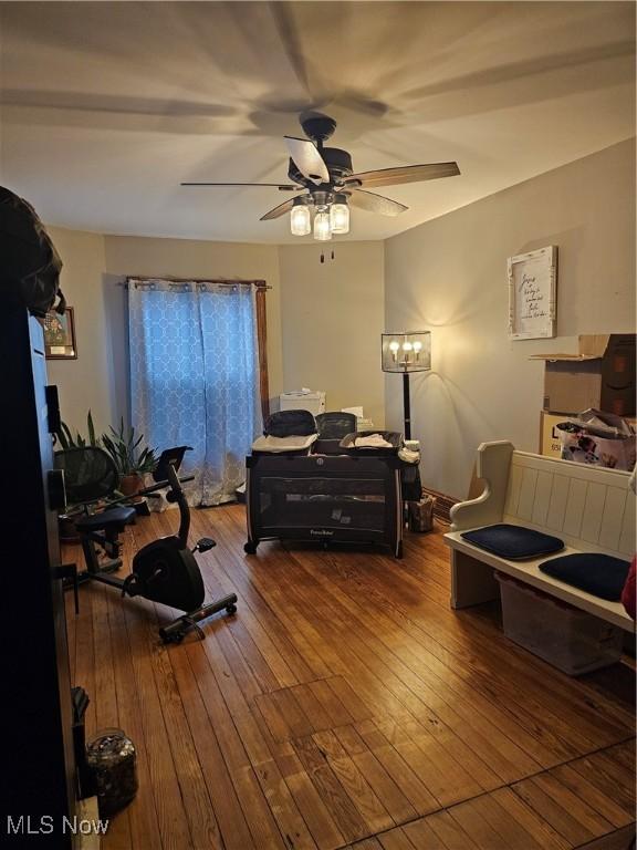 interior space with ceiling fan and wood finished floors