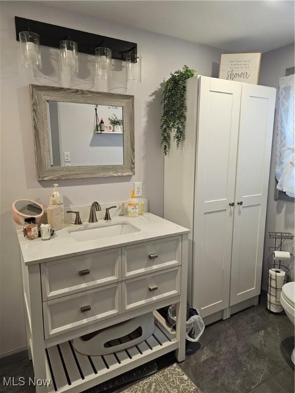 bathroom with vanity and toilet