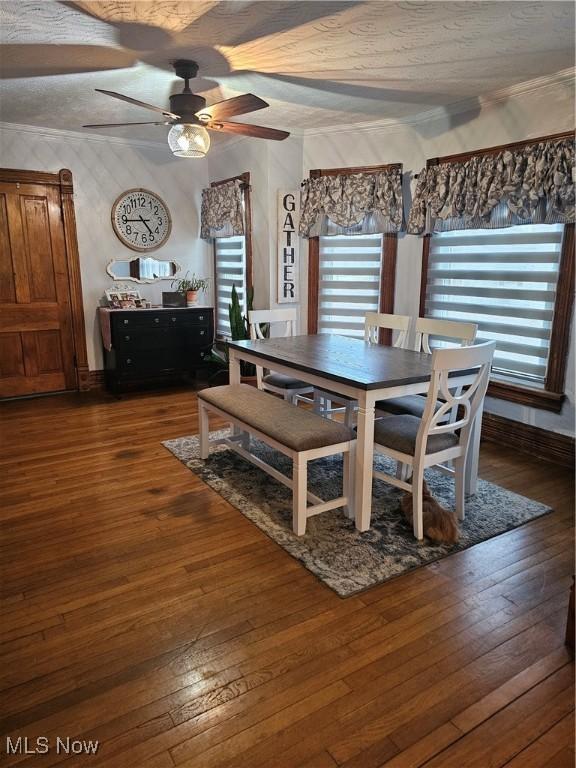 dining room featuring ceiling fan and dark wood-style flooring