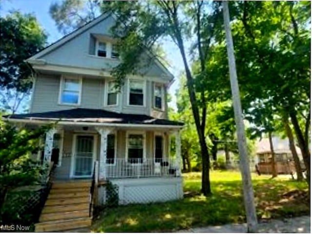 traditional style home with covered porch