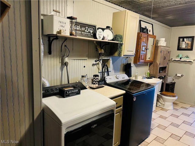 kitchen with a sink, open shelves, independent washer and dryer, and light countertops