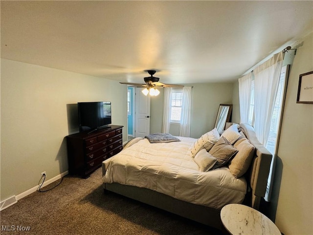 bedroom with ceiling fan, carpet flooring, visible vents, and baseboards