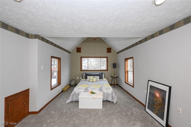 bedroom with lofted ceiling, baseboards, and light colored carpet