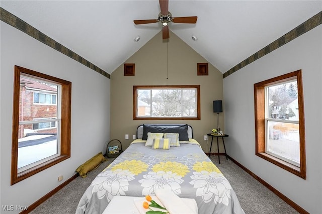 bedroom featuring carpet floors, vaulted ceiling, baseboards, and a ceiling fan