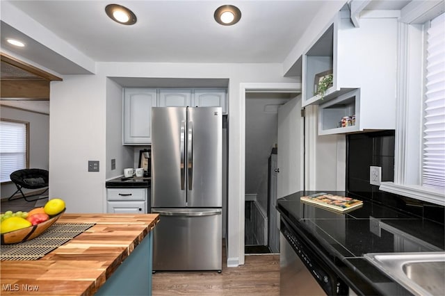 kitchen featuring dark wood-style flooring, open shelves, recessed lighting, butcher block counters, and appliances with stainless steel finishes