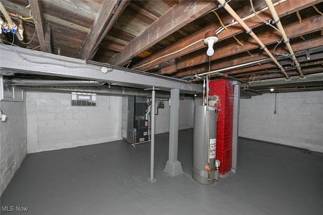 below grade area featuring gas water heater and heating unit