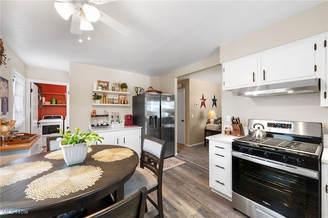 28628 Aspen Dr, North Olmsted, OH 44070 - kitchen featuring appliances with stainless steel finishes, under cabinet range hood, wood finished floors, light countertops, and a ceiling fan