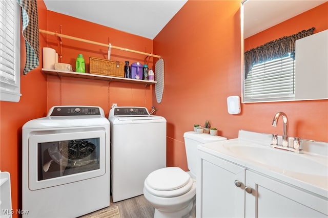 28628 Aspen Dr, North Olmsted, OH 44070 - laundry area featuring washer and clothes dryer and light wood-style flooring