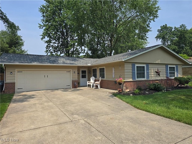 28628 Aspen Dr, North Olmsted, OH 44070 - ranch-style home featuring brick siding, a garage, driveway, and a front lawn