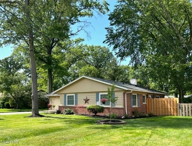 28628 Aspen Dr, North Olmsted, OH 44070 - ranch-style house featuring brick siding, a chimney, and a garage