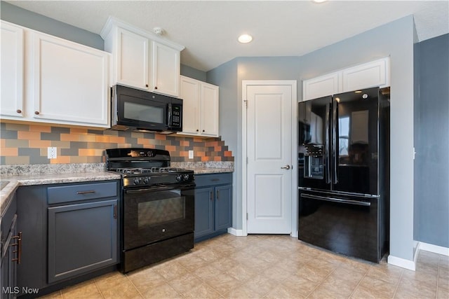 kitchen featuring baseboards, white cabinets, decorative backsplash, blue cabinets, and black appliances