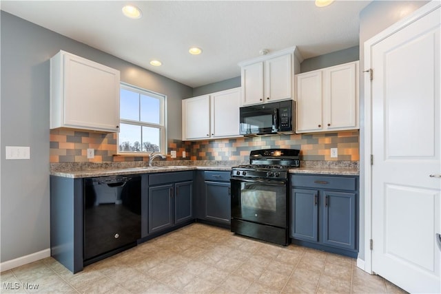 kitchen with blue cabinetry, white cabinetry, backsplash, and black appliances