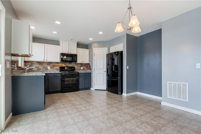 kitchen featuring gray cabinetry, visible vents, white cabinets, black appliances, and decorative light fixtures