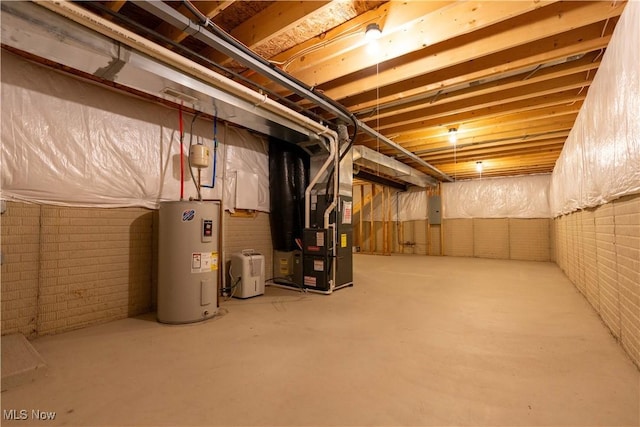 unfinished basement featuring electric panel, water heater, brick wall, and heating unit