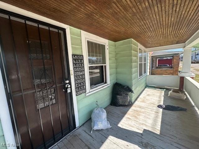 doorway to property featuring covered porch