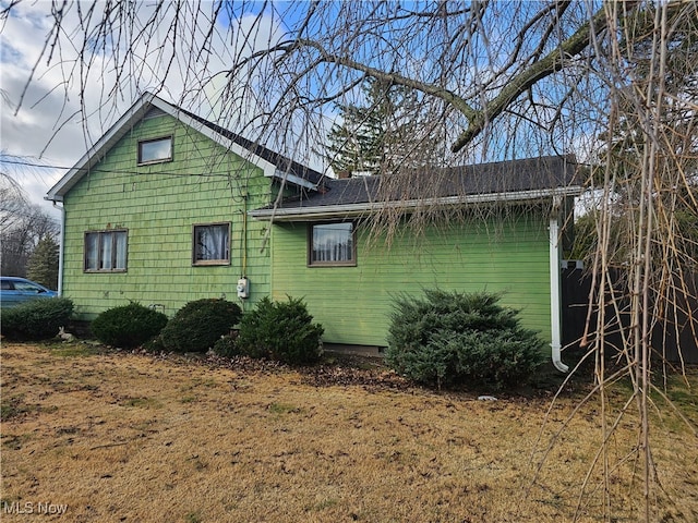 view of home's exterior featuring a yard