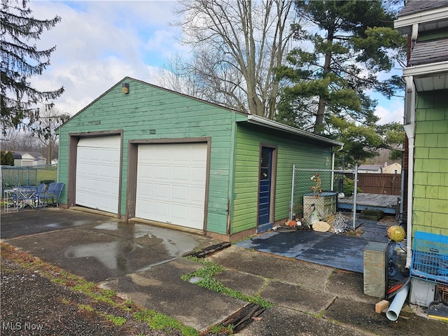 detached garage with fence