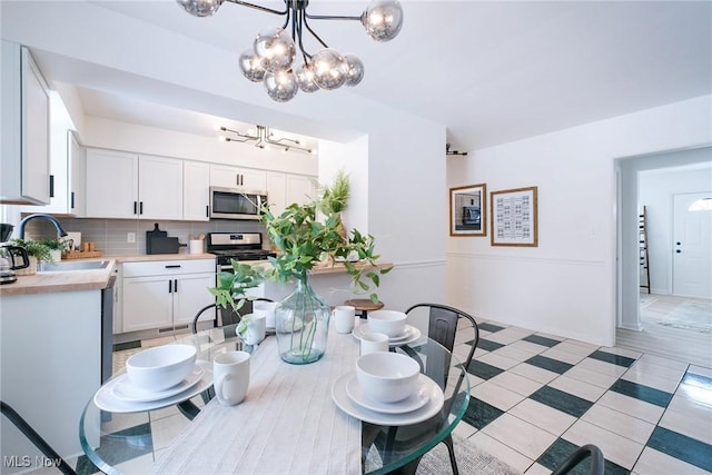 dining space featuring a chandelier