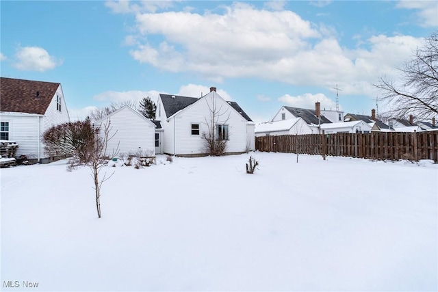 exterior space with a residential view and fence