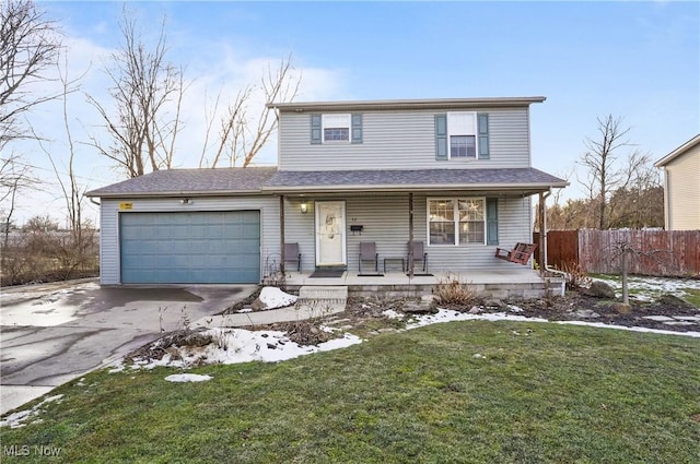 traditional-style home featuring a porch, concrete driveway, a lawn, an attached garage, and fence