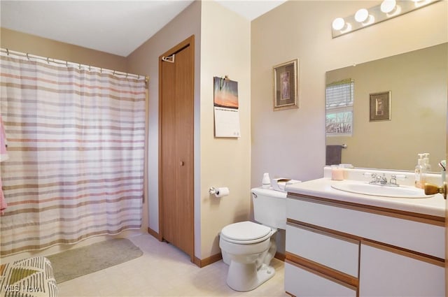 full bath featuring vanity, toilet, and tile patterned floors