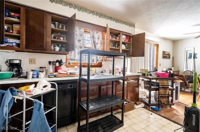 kitchen with light countertops, ceiling fan, a textured ceiling, dark brown cabinets, and dishwasher