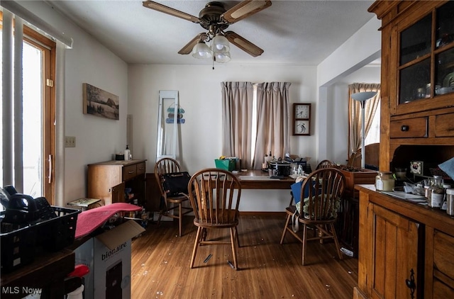 dining space featuring light wood-type flooring, plenty of natural light, and ceiling fan