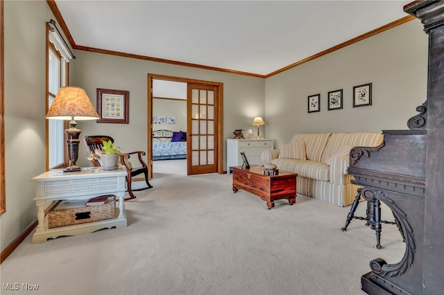 living area with light carpet, french doors, ornamental molding, and baseboards