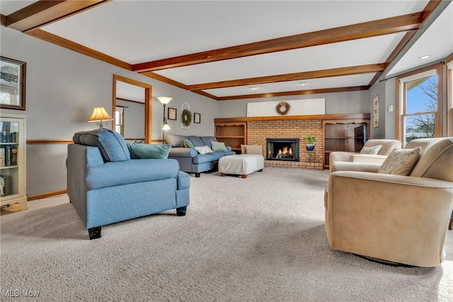 living area with light carpet, a fireplace, baseboards, and beam ceiling