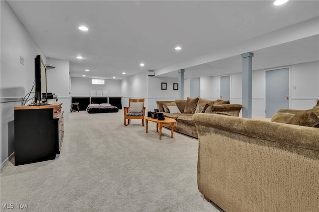 living room featuring light carpet and recessed lighting